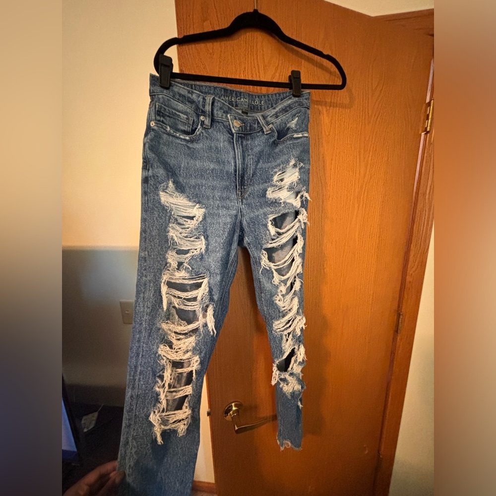 Stretchy criss cross distressed blue jeans